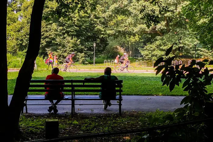 A photo of two people sitting in Prospect Park